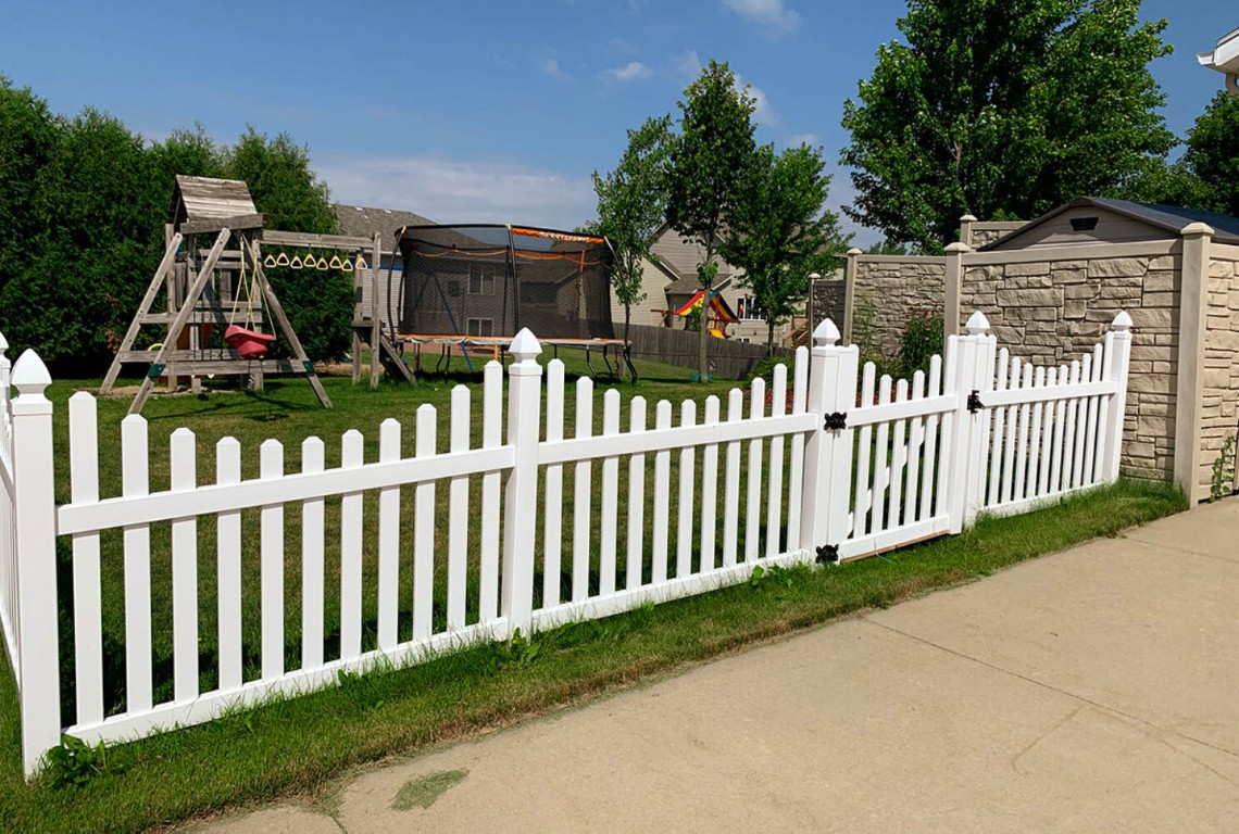 Classic white aluminum picket fence with gate in Tulare, CA